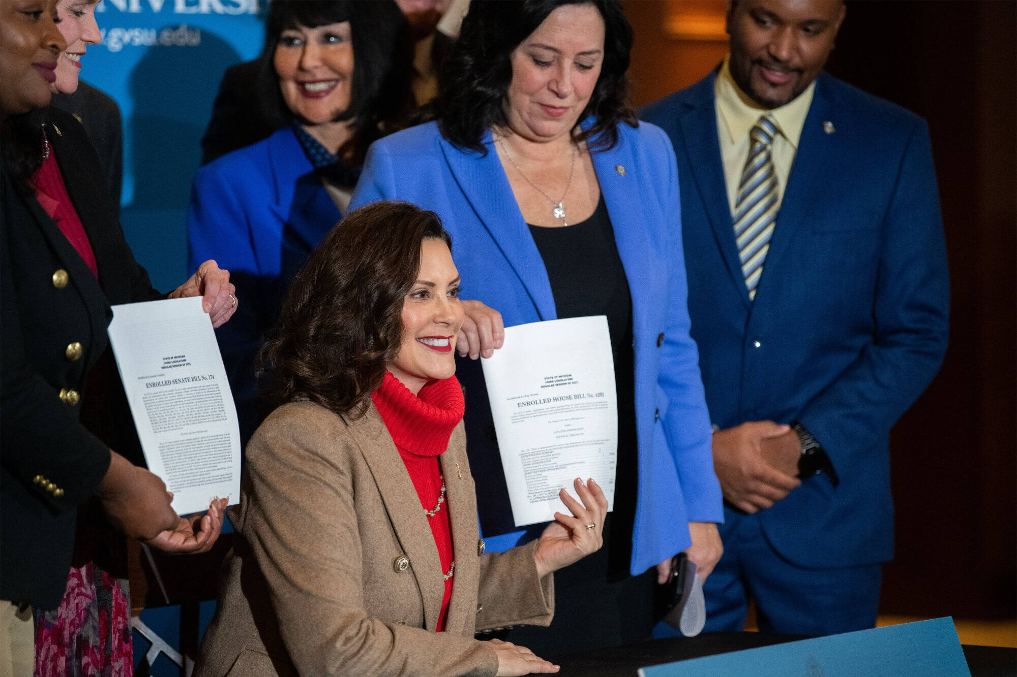 Whitmer signing the bill for BlueDot